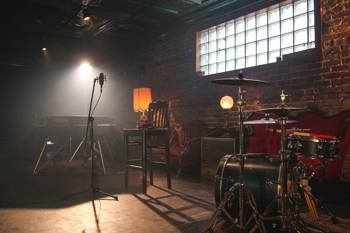 Rehearsal studio with keyboard, microphone, and drums